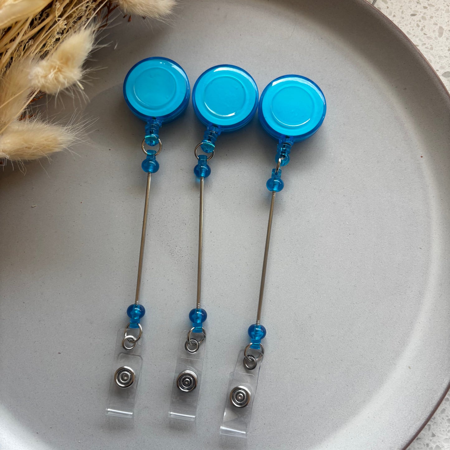 Blue Badge Reel With Beadable Post KK Scents & Co.