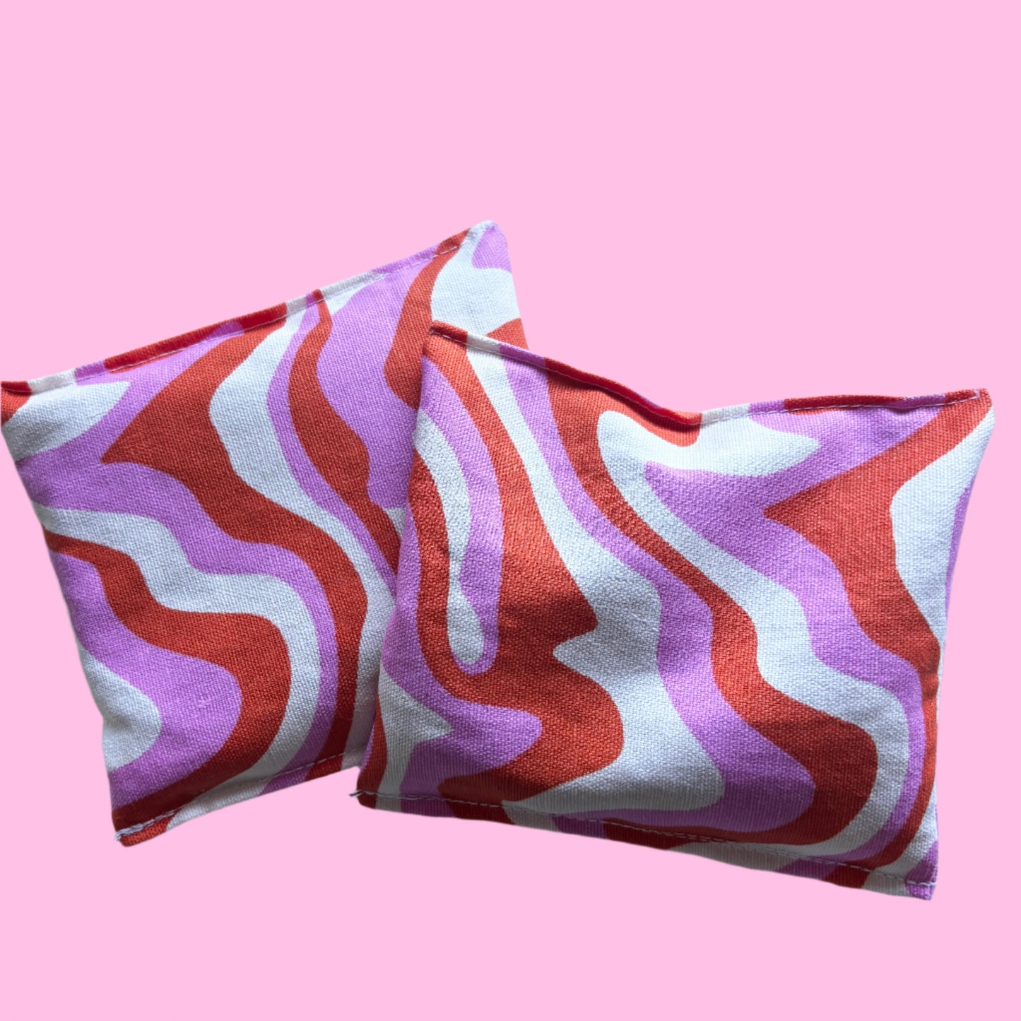 pink swirl hand warmers