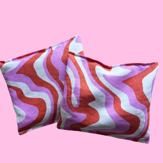 pink swirl hand warmers